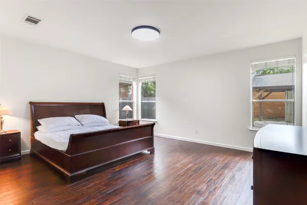 a bedroom with a bed and window