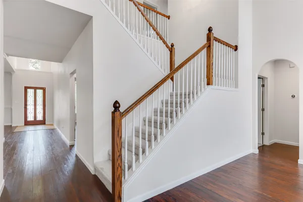 a view of an entryway with wooden floor