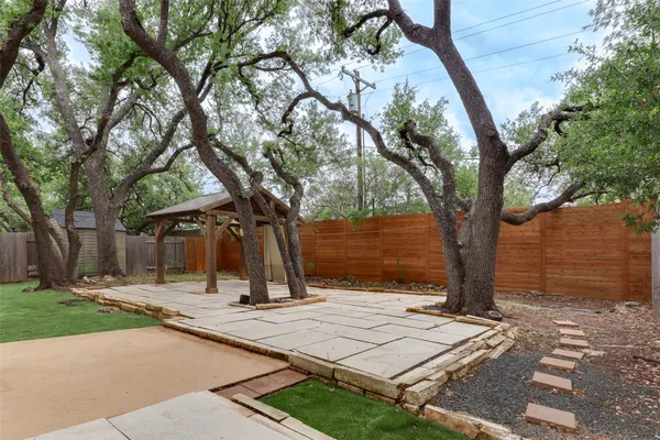 a sign board with yard in front of it