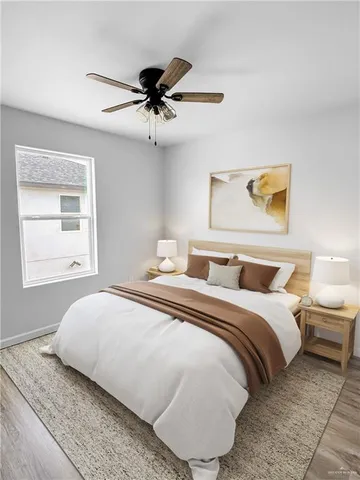 a bedroom with a bed and window