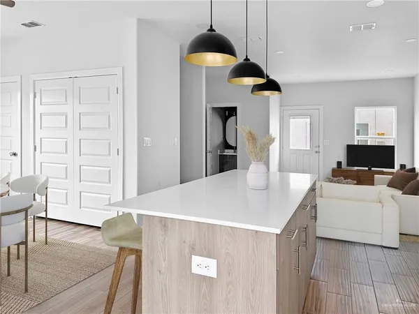 a living room with furniture and wooden floor