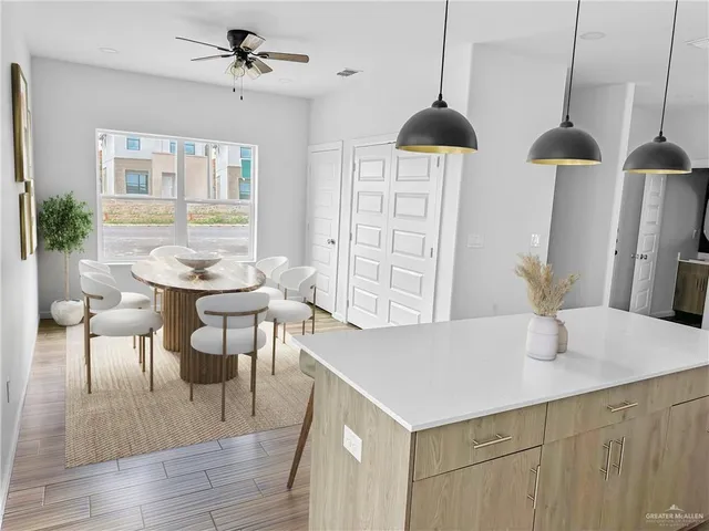 a dining room with furniture and window