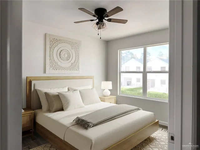 a bedroom with a bed and a window