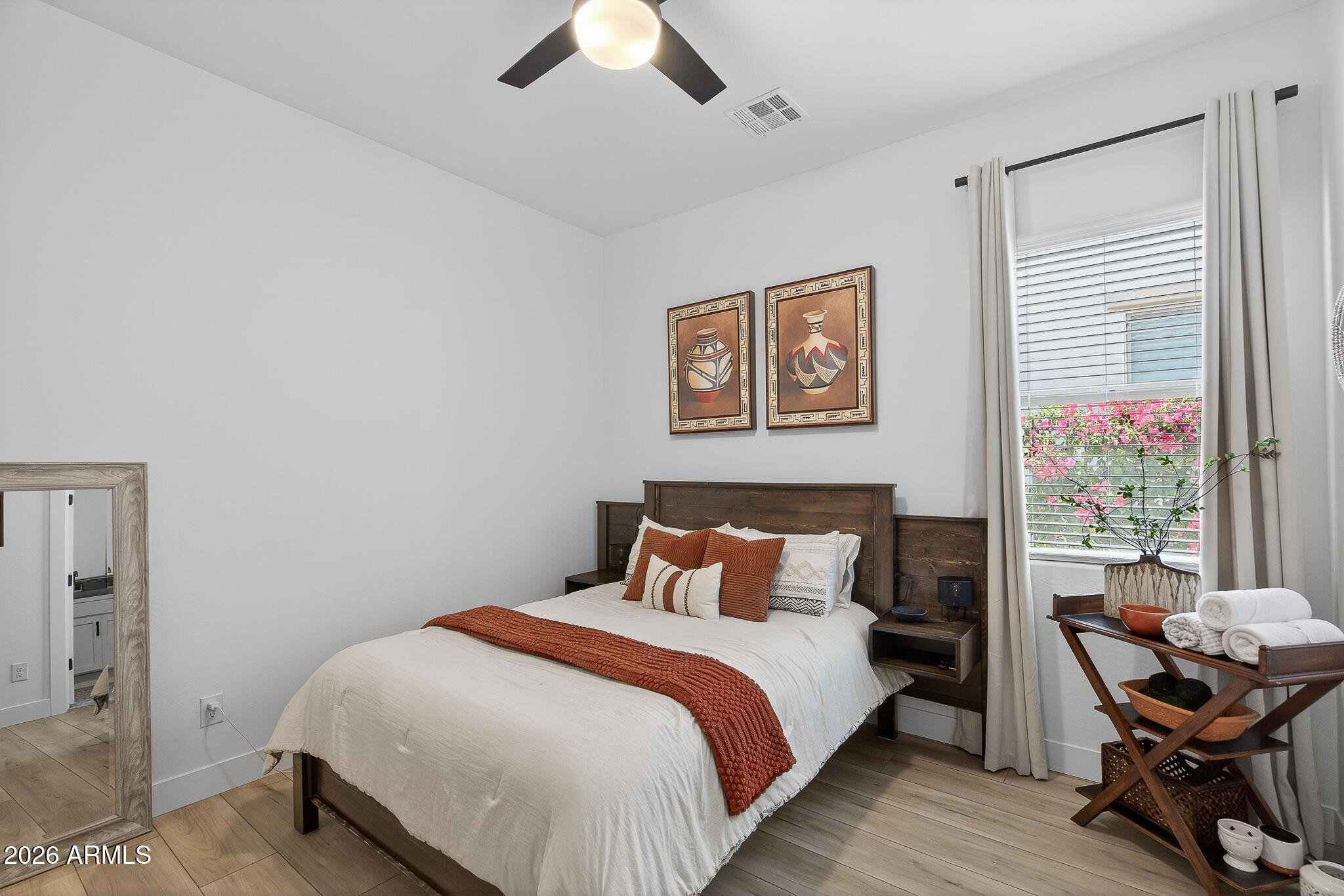 20627 West Rancho Drive Buckeye, AZ 85396 - Photo 25 of 82 a bedroom with a bed and chair