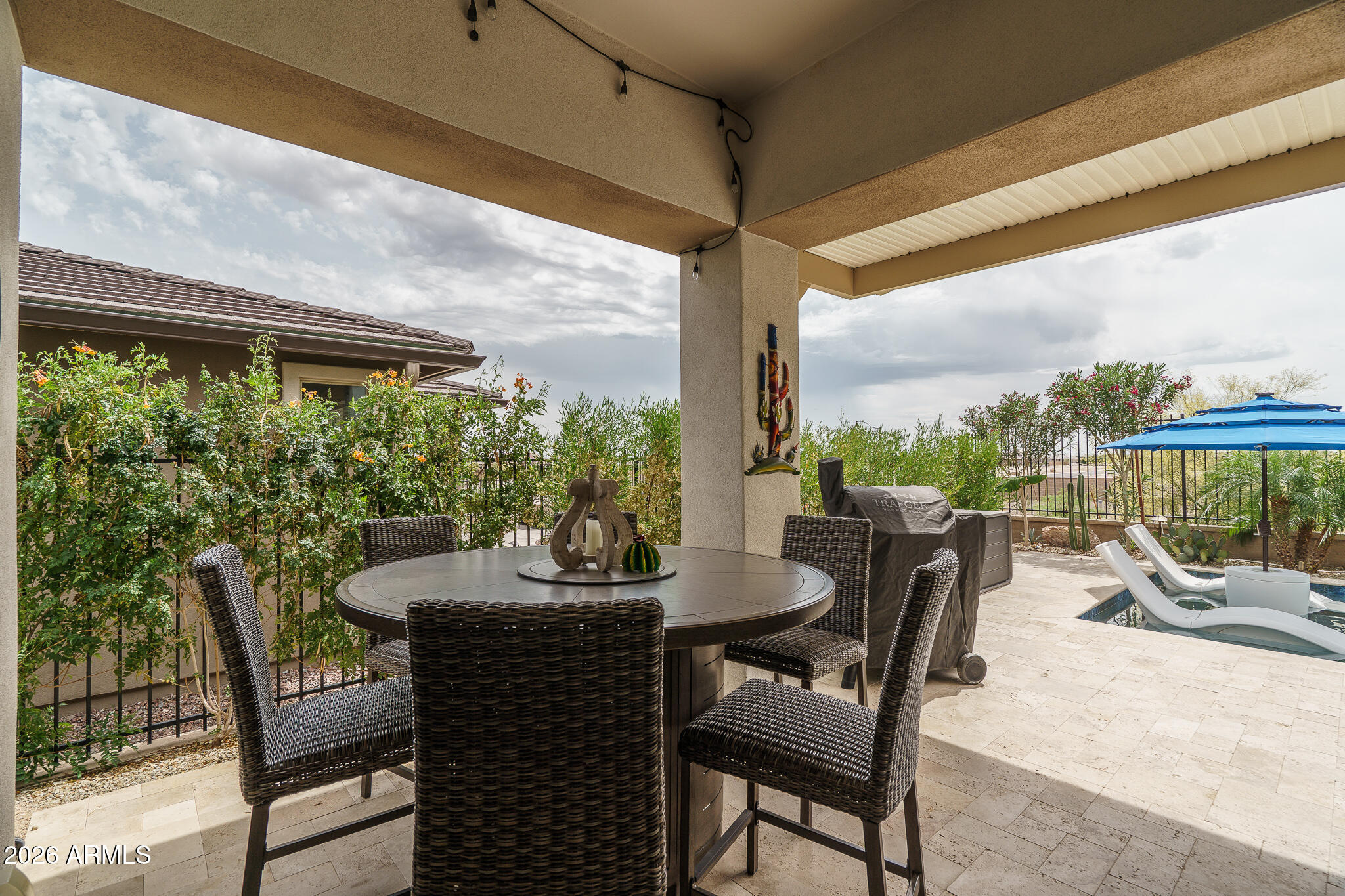 20627 West Rancho Drive Buckeye, AZ 85396 - Photo 30 of 82 a dining room with furniture and a floor to ceiling window