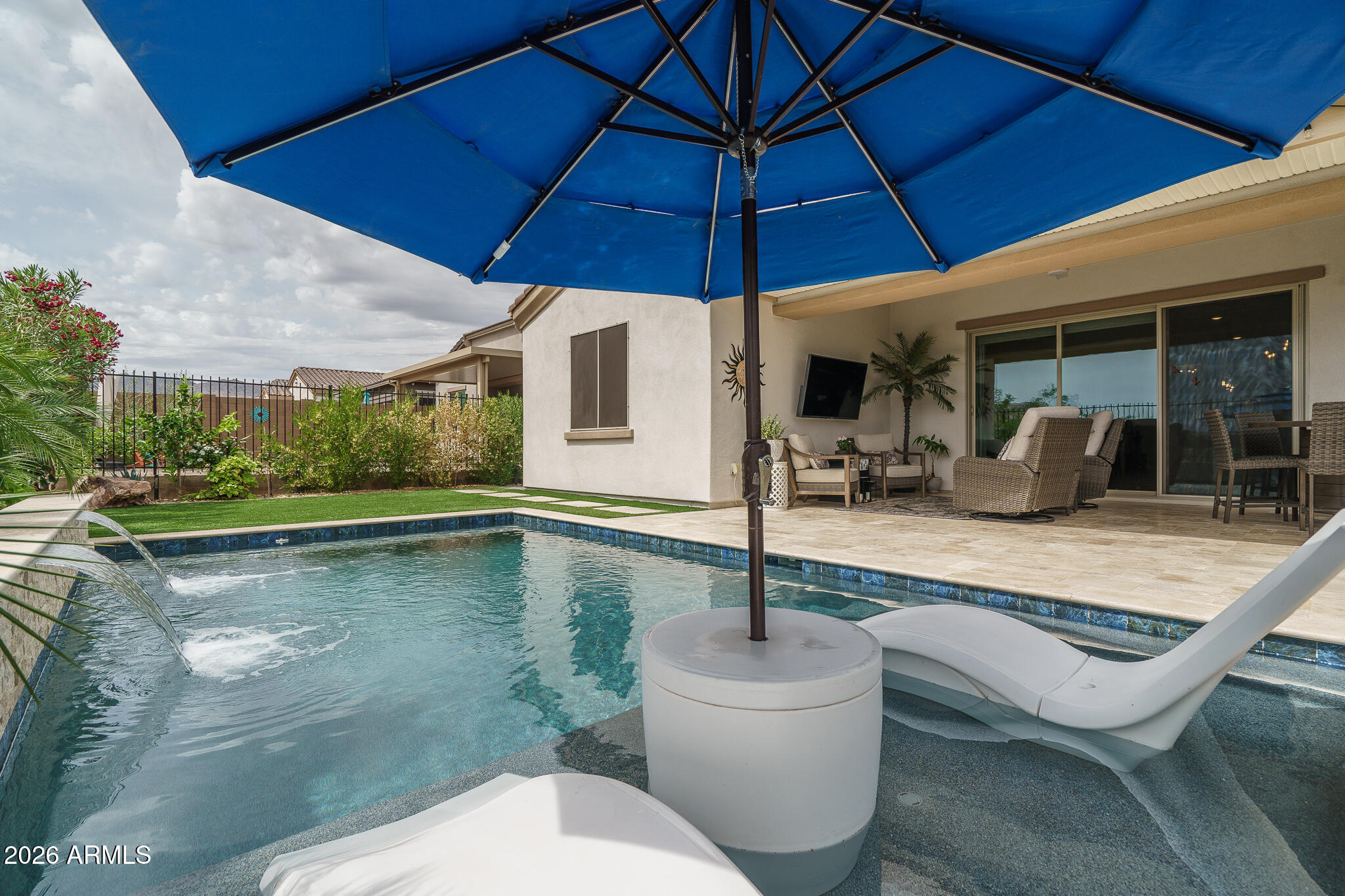 20627 West Rancho Drive Buckeye, AZ 85396 - Photo 38 of 82 a swimming pool with outdoor seating yard and patio