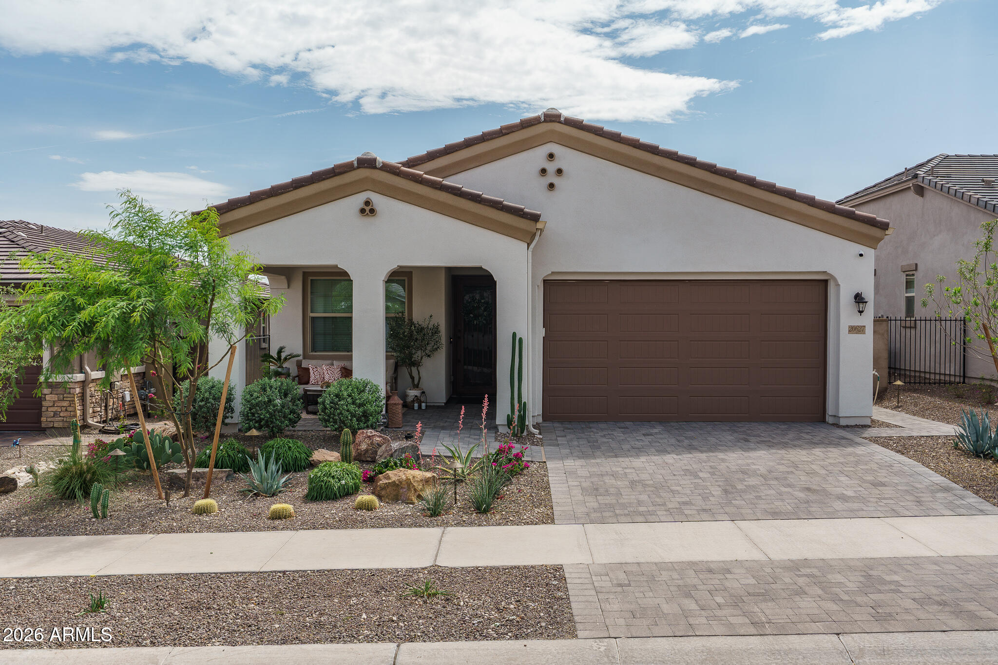 20627 West Rancho Drive Buckeye, AZ 85396 - Photo 3 of 82 a front view of a house with garage and plants