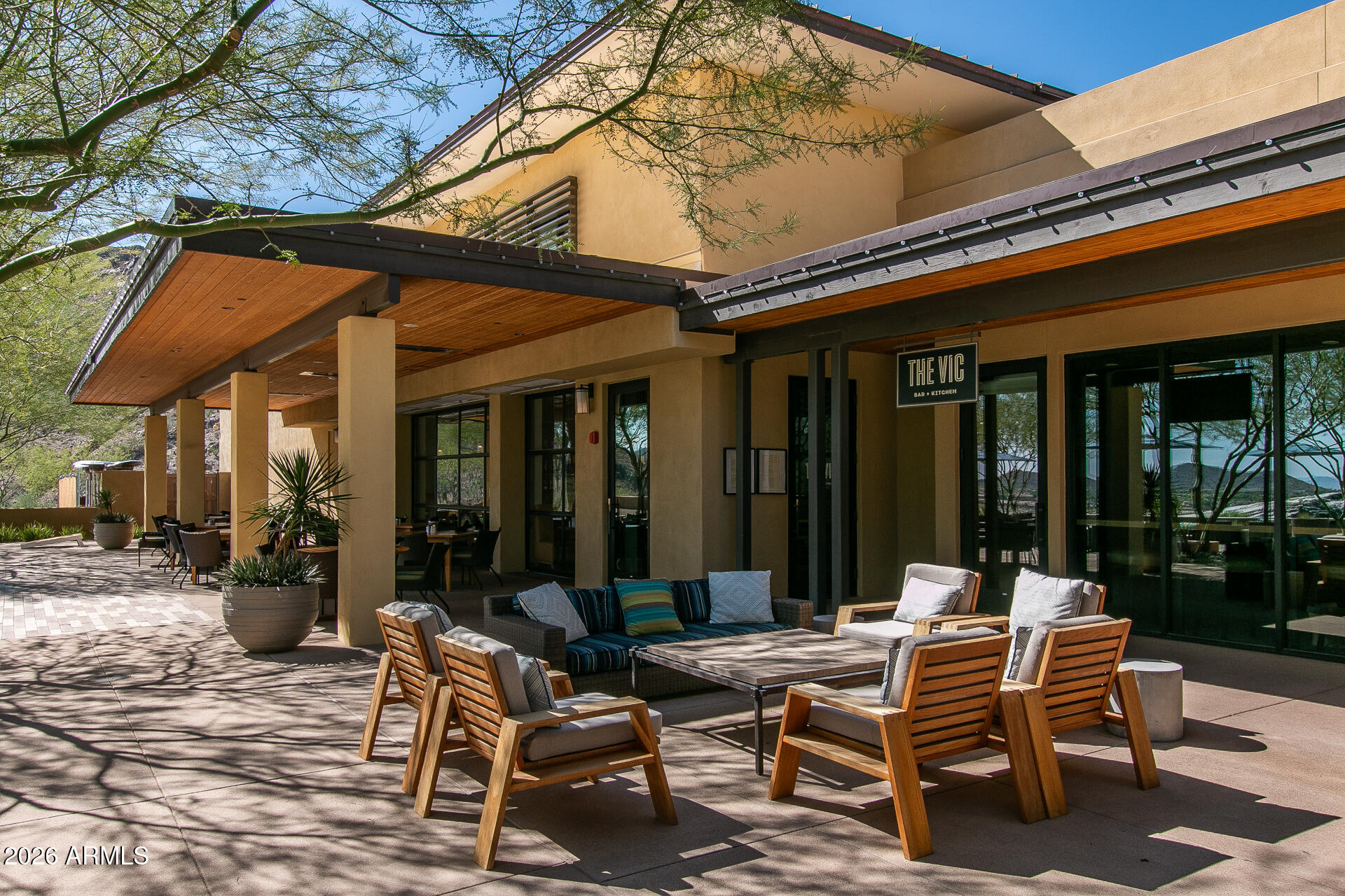 20627 West Rancho Drive Buckeye, AZ 85396 - Photo 59 of 82 a view of a patio with table and chairs and floor to ceiling window