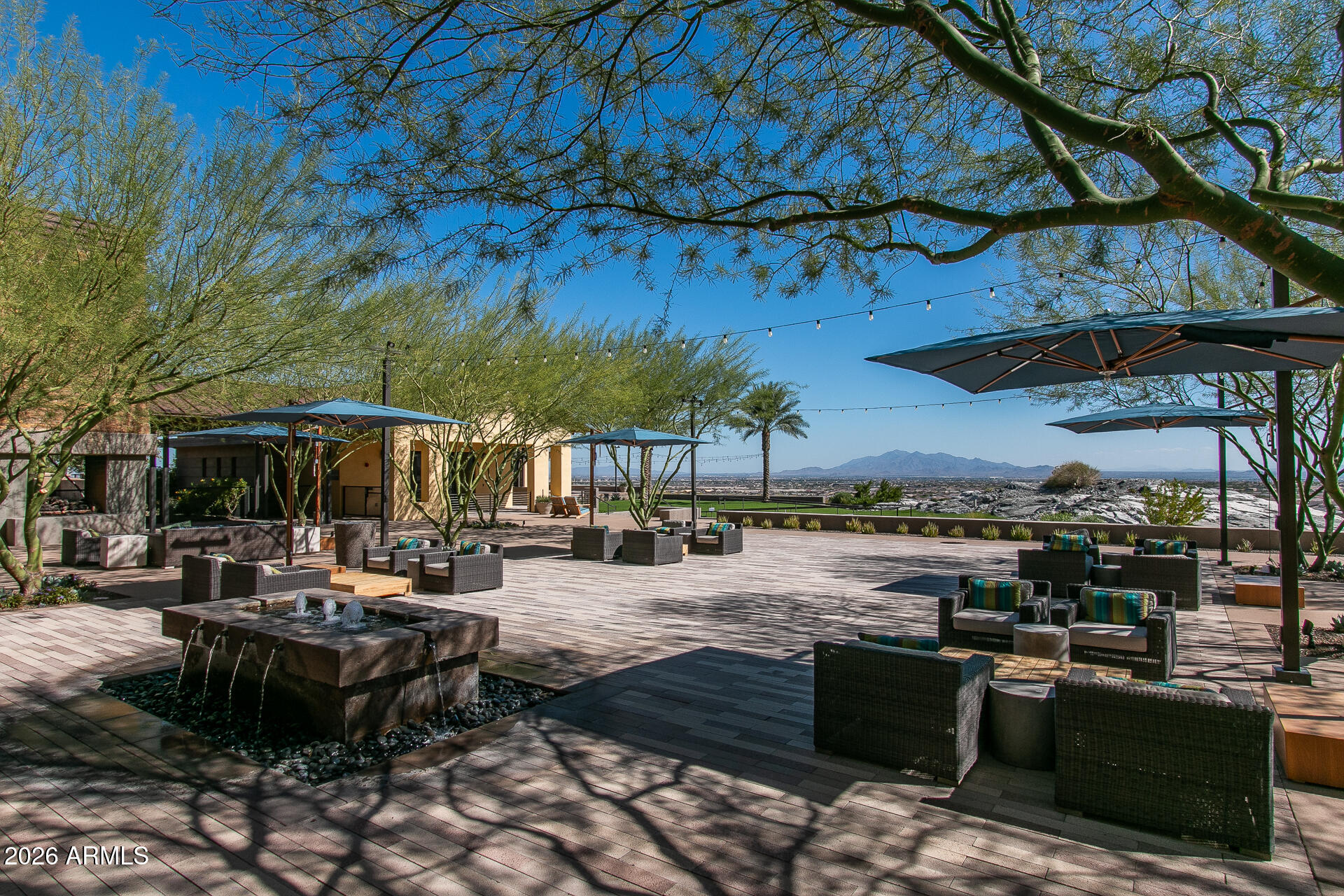 20627 West Rancho Drive Buckeye, AZ 85396 - Photo 61 of 82 a view of a patio with a table and chairs under an umbrella