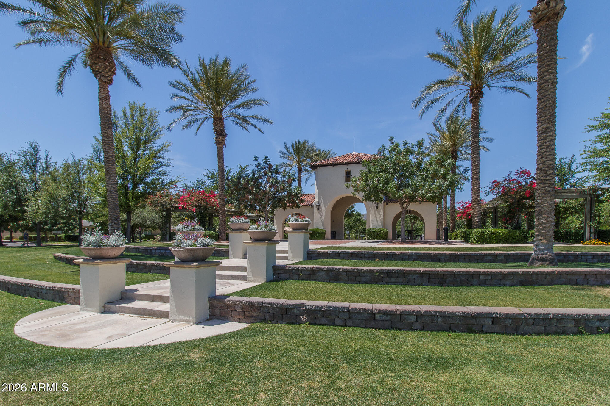 20627 West Rancho Drive Buckeye, AZ 85396 - Photo 75 of 82 a view of a house with a swimming pool and a garden