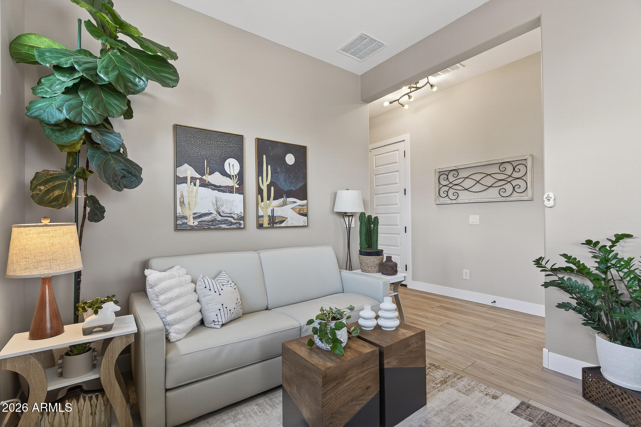 20627 West Rancho Drive Buckeye, AZ 85396 - Photo 7 of 82 a living room with furniture flowerpot and a potted plant