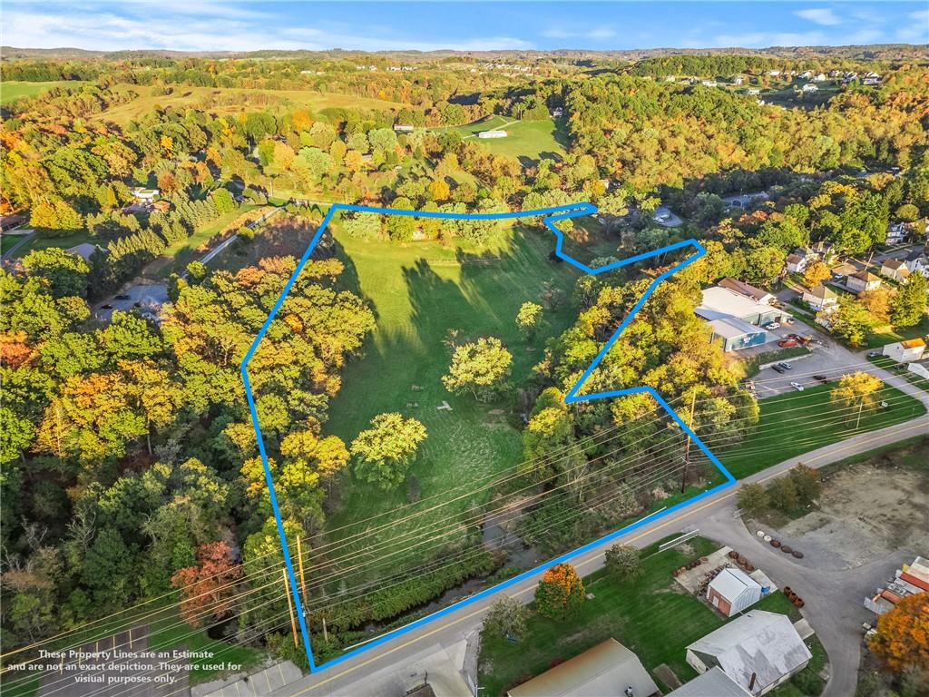 438 Spring Street Extension Mars, PA 16046 - Photo 7 of 13 a view of a lake with a tree