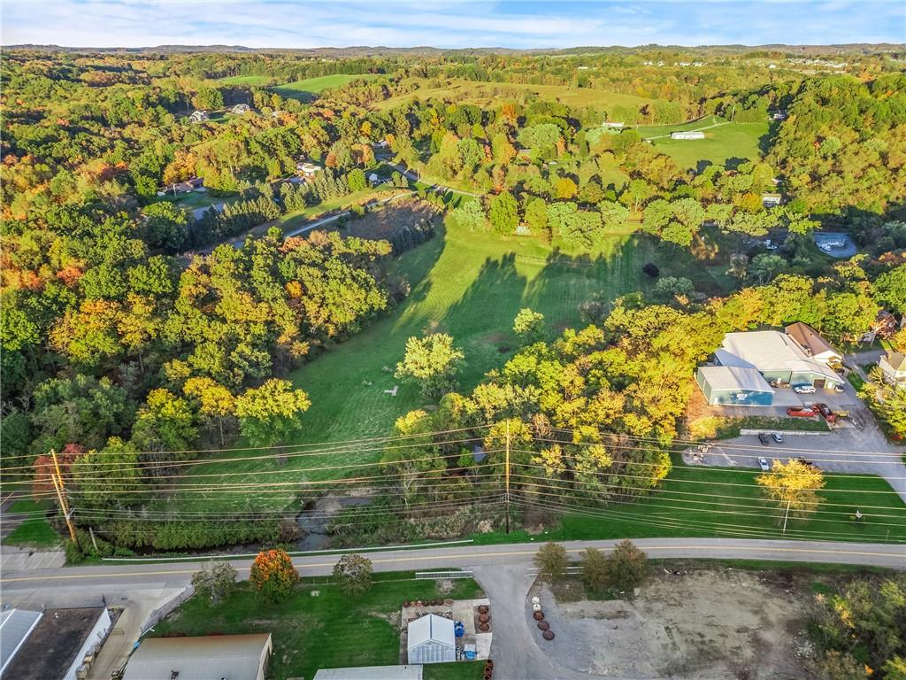 438 Spring Street Extension Mars, PA 16046 - Photo 8 of 13 a view of a yard with an outdoor space
