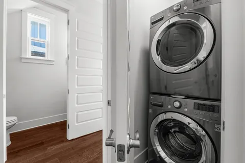 a view of a hallway with washer and dryer