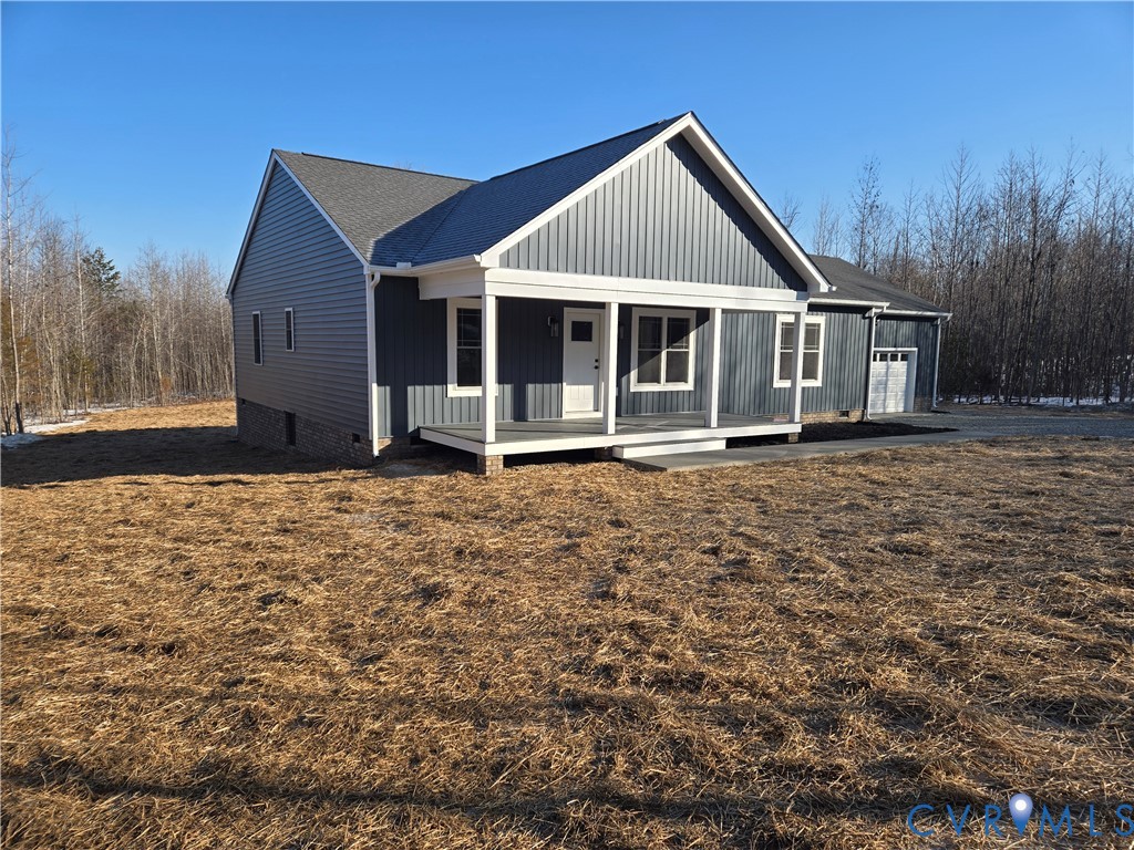 1781 Bumpass Road Bumpass, VA 23024 - Photo 5 of 26 a front view of a house with a yard