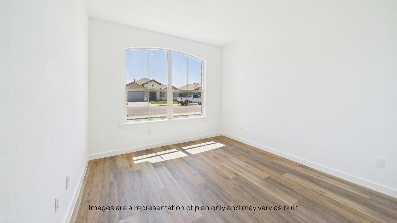 2812 134th Street Lubbock, TX 79423 - Photo 14 of 36 a view of an empty room with wooden floor and a window