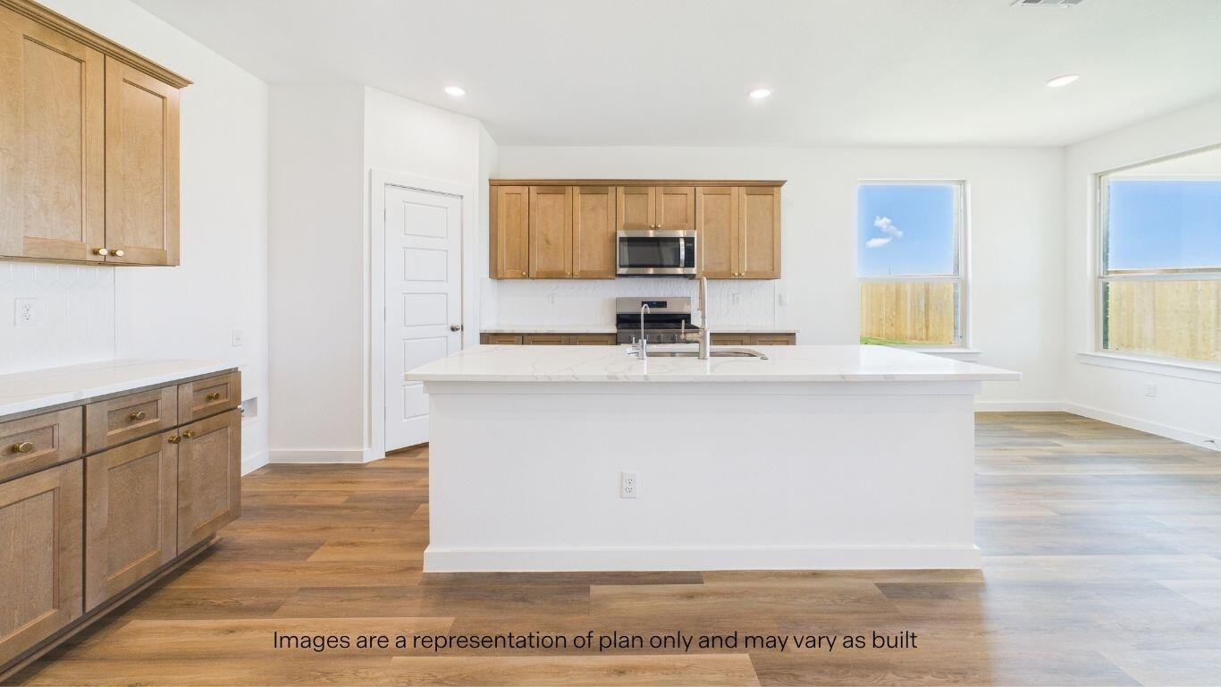 2812 134th Street Lubbock, TX 79423 - Photo 6 of 36 a kitchen with cabinets and wooden floor