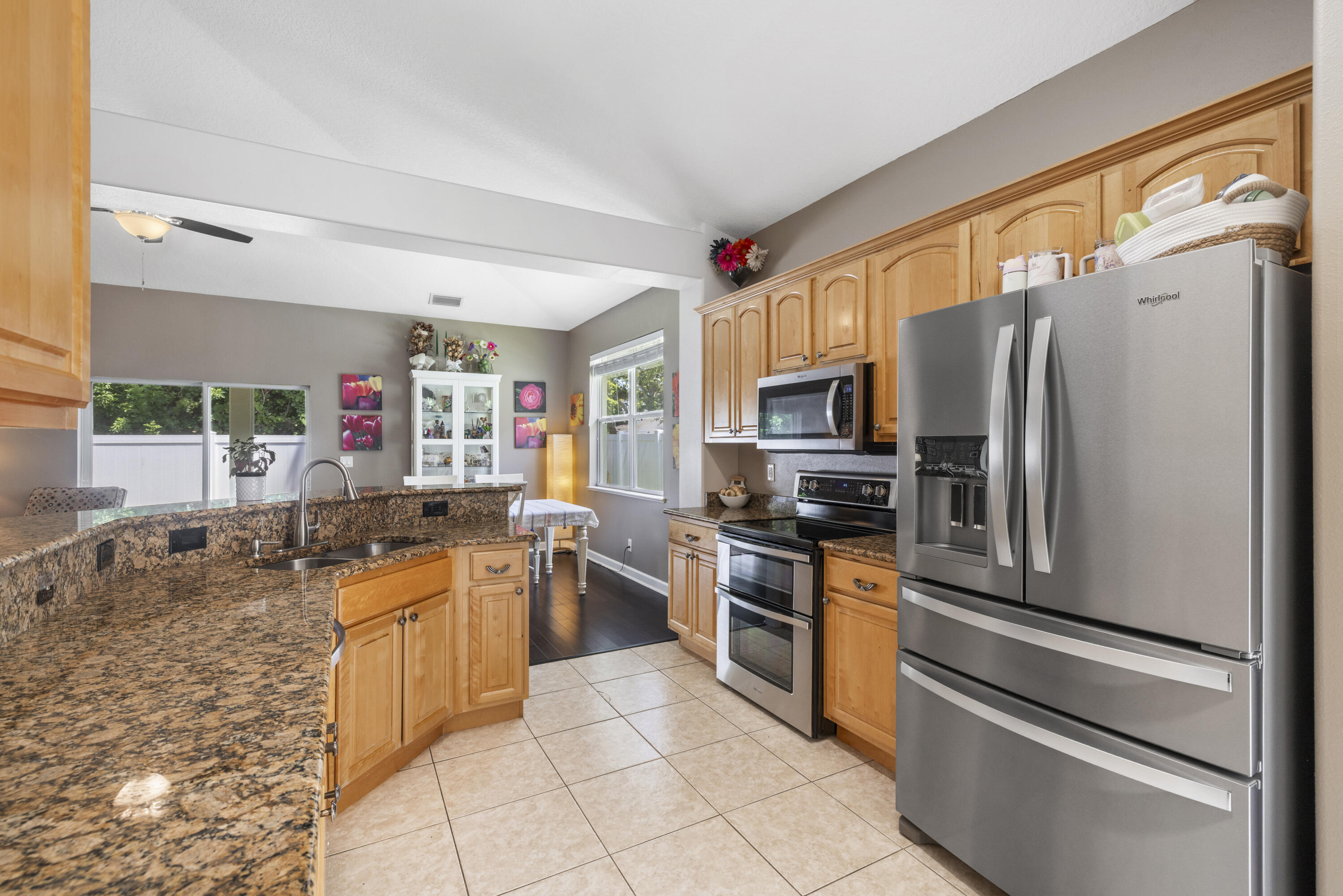110 Briarcliff Circle Sebastian, FL 32958 - Photo 11 of 42 a kitchen with stainless steel appliances granite countertop a refrigerator sink and stove