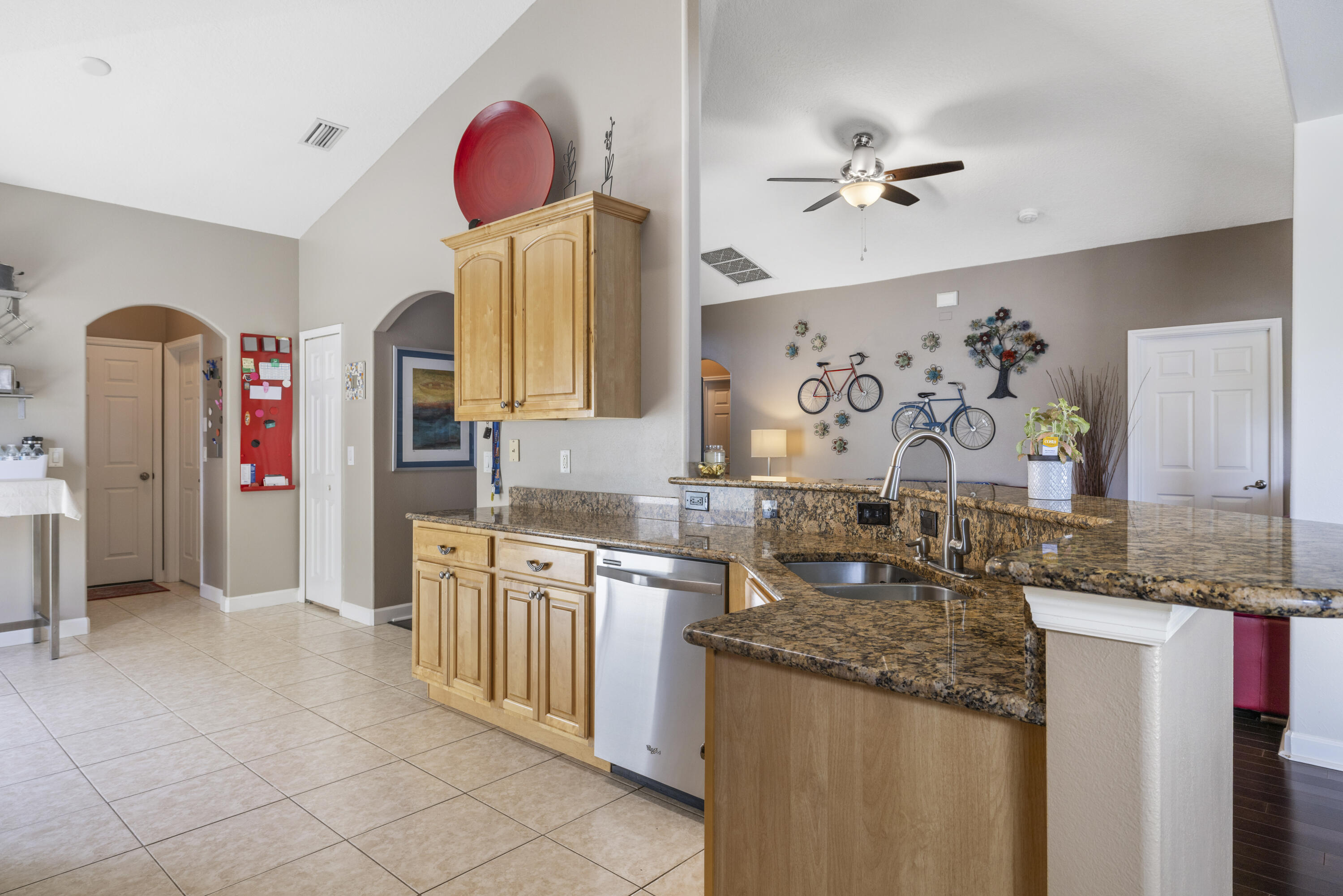 110 Briarcliff Circle Sebastian, FL 32958 - Photo 14 of 42 a kitchen with stainless steel appliances granite countertop a sink and cabinets