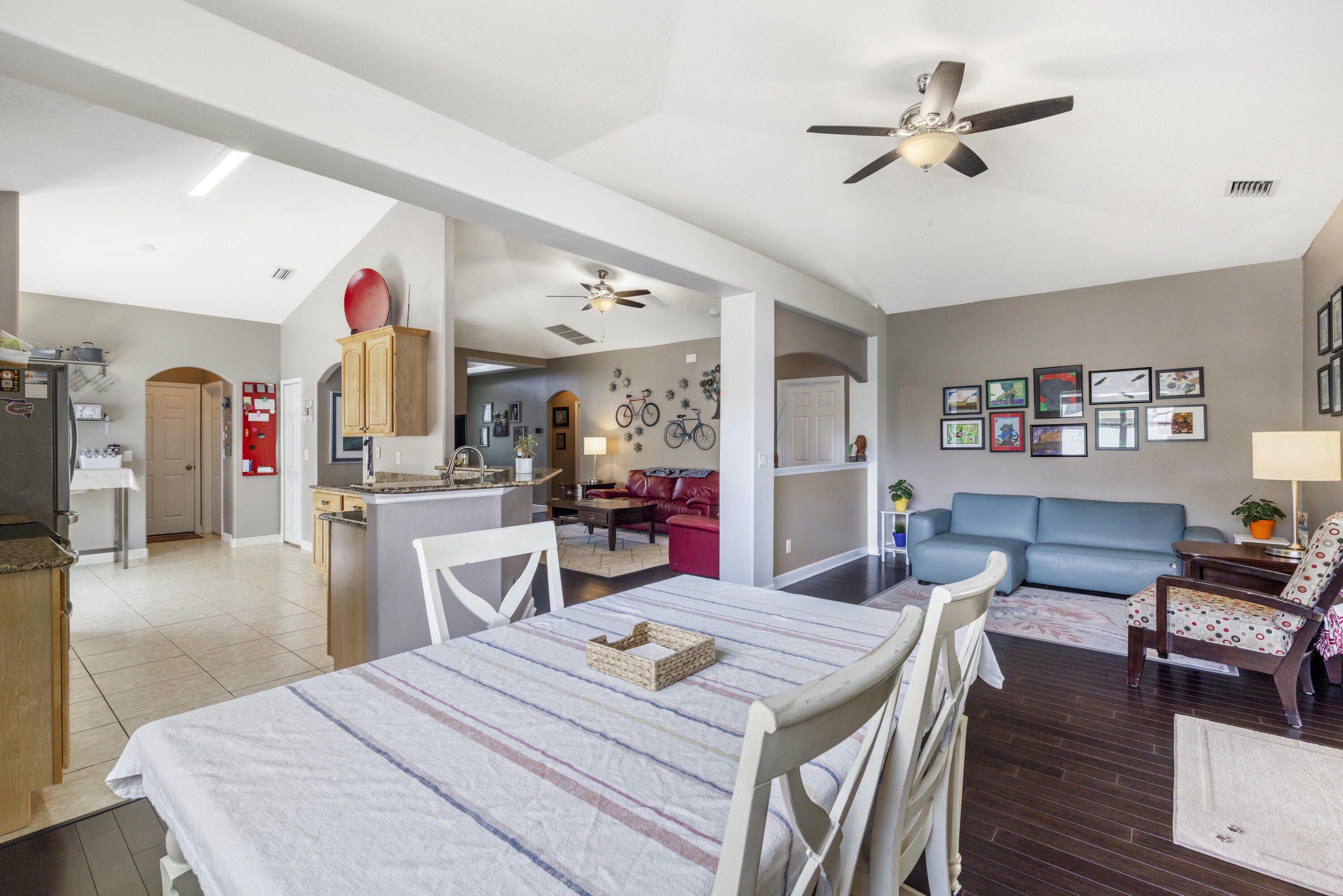 110 Briarcliff Circle Sebastian, FL 32958 - Photo 17 of 42 a living room with stainless steel appliances kitchen island furniture and wooden floor
