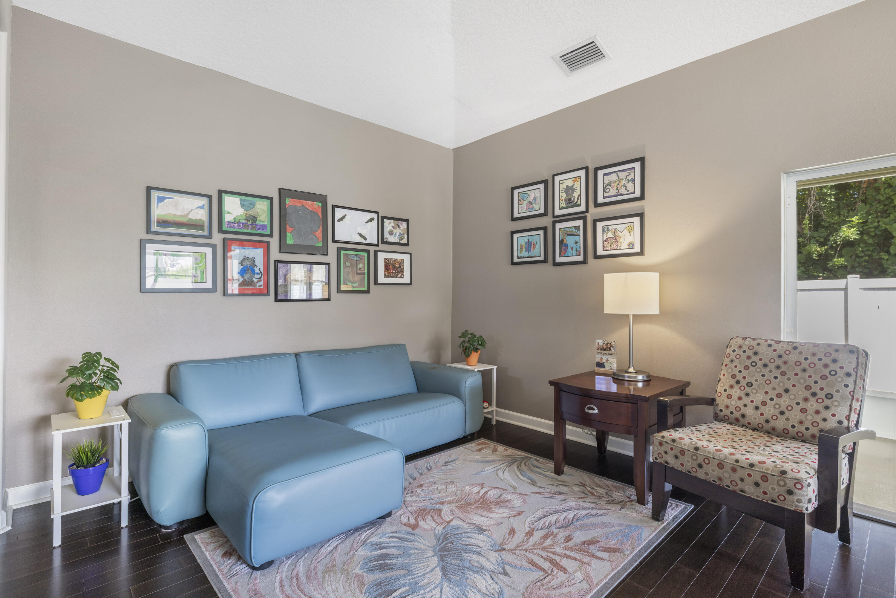 110 Briarcliff Circle Sebastian, FL 32958 - Photo 19 of 42 a living room with furniture and a potted plant next to a window