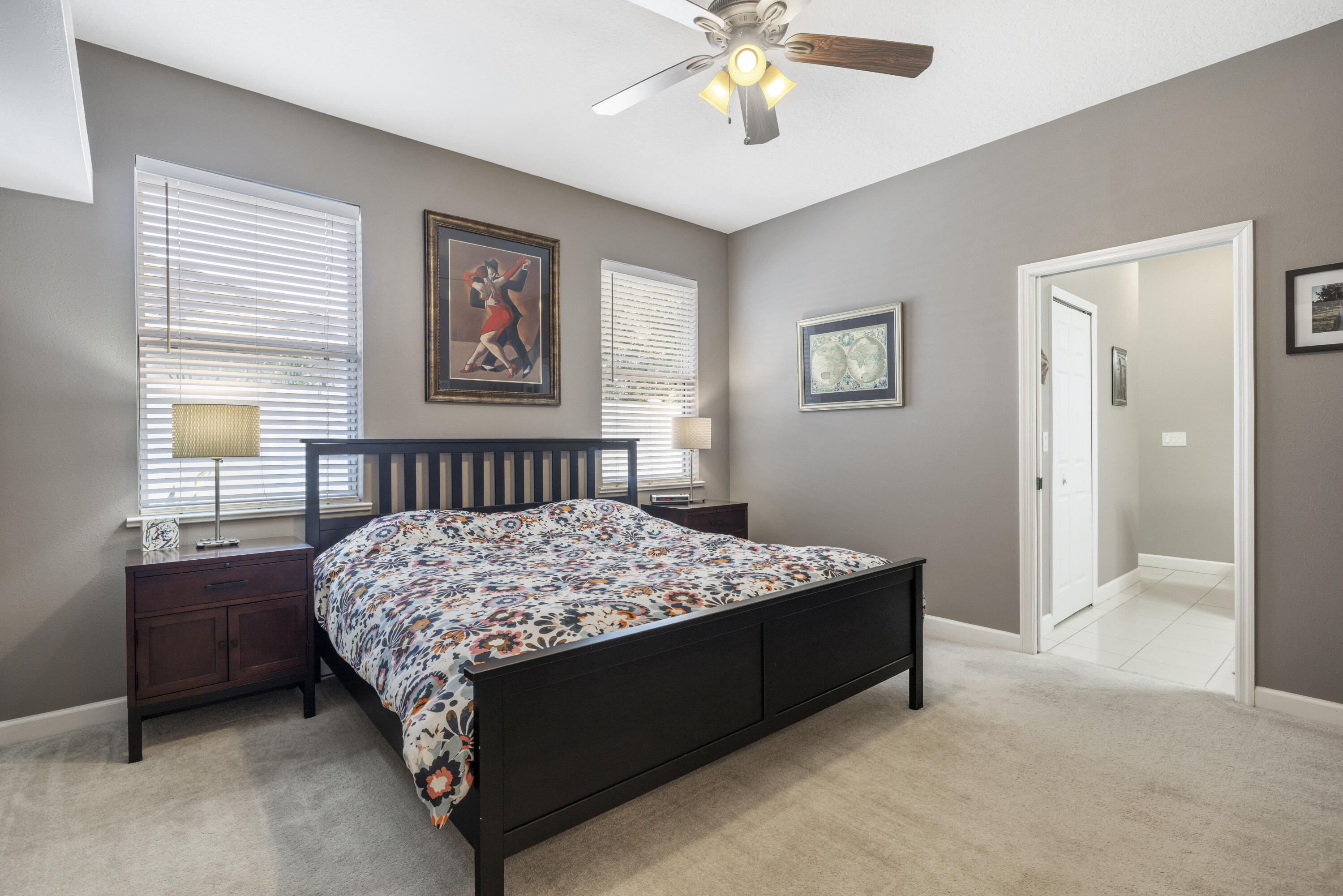 110 Briarcliff Circle Sebastian, FL 32958 - Photo 22 of 42 a bedroom with a bed and a chandelier