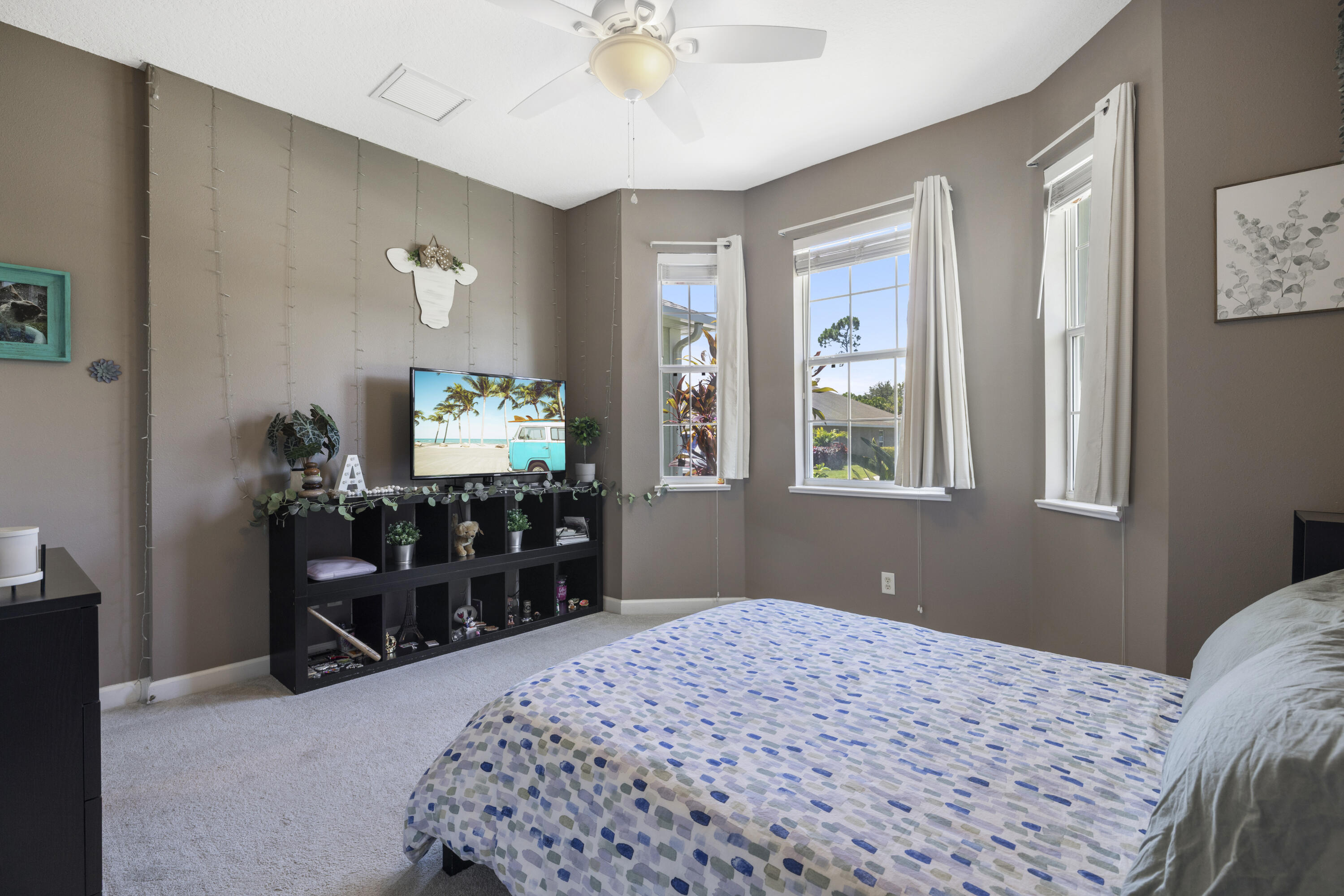 110 Briarcliff Circle Sebastian, FL 32958 - Photo 28 of 42 a bedroom with a bed and a flat tv screen