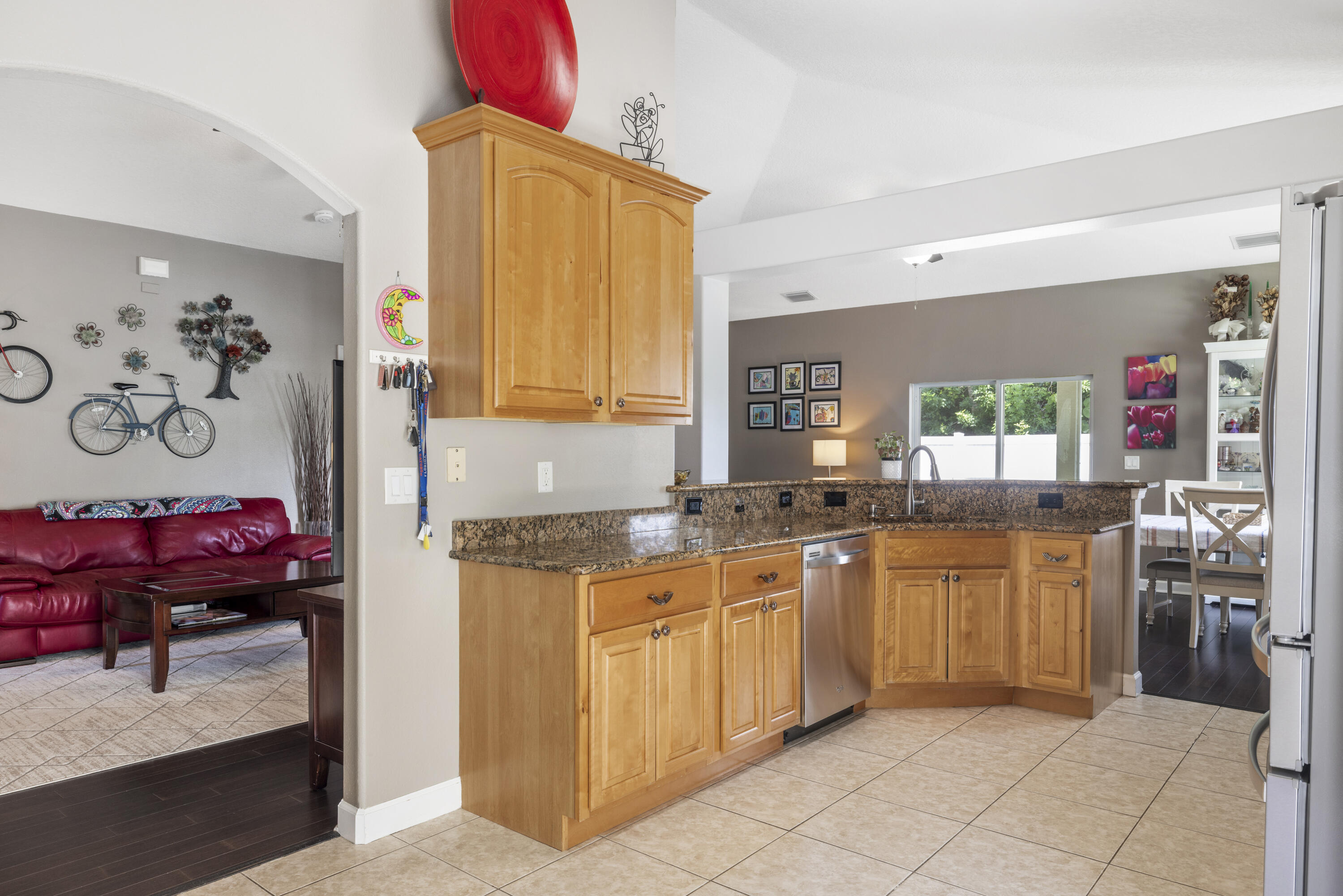 110 Briarcliff Circle Sebastian, FL 32958 - Photo 8 of 42 a kitchen with stainless steel appliances granite countertop a sink and cabinets