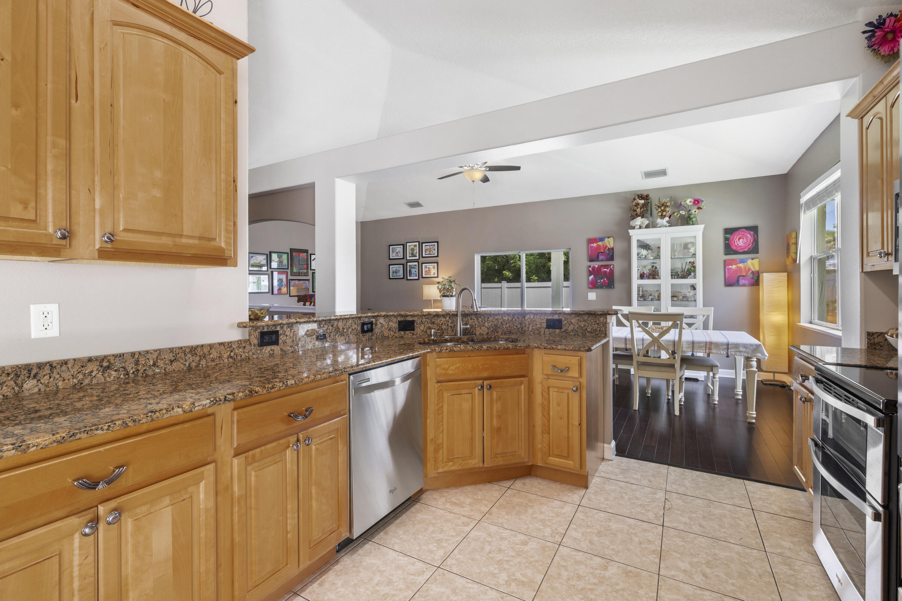 110 Briarcliff Circle Sebastian, FL 32958 - Photo 10 of 42 a kitchen with stainless steel appliances granite countertop a sink counter space cabinets and a stove