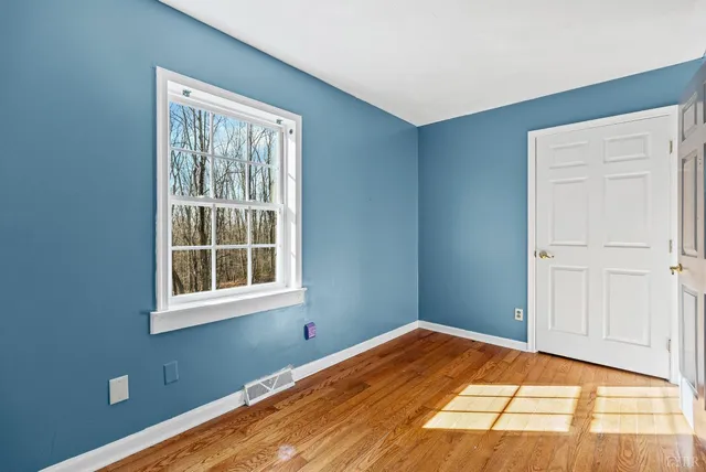 a view of a room that has a window in it