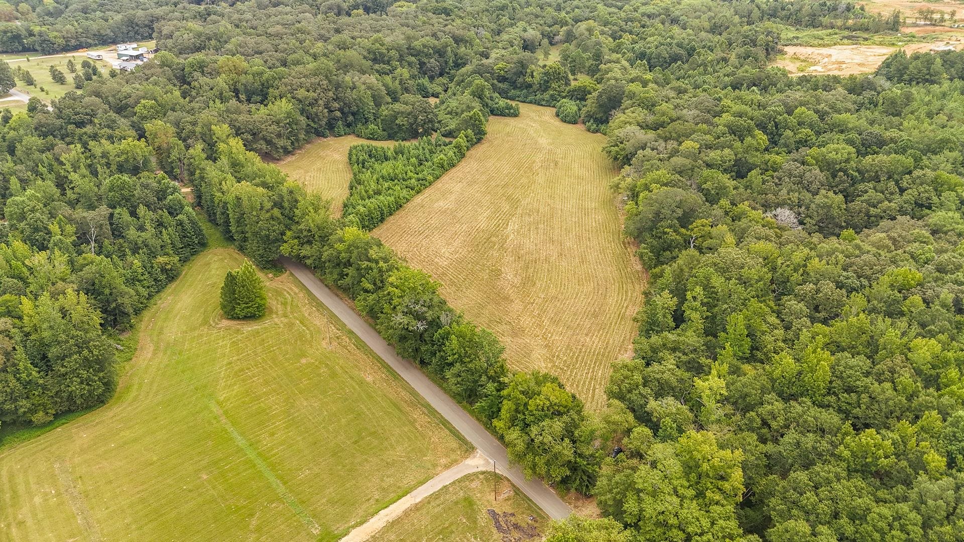 0 Seaton Loop Adamsville, TN 38310 - Photo 1 of 14 Overview of rural landscape featuring a heavily wooded area