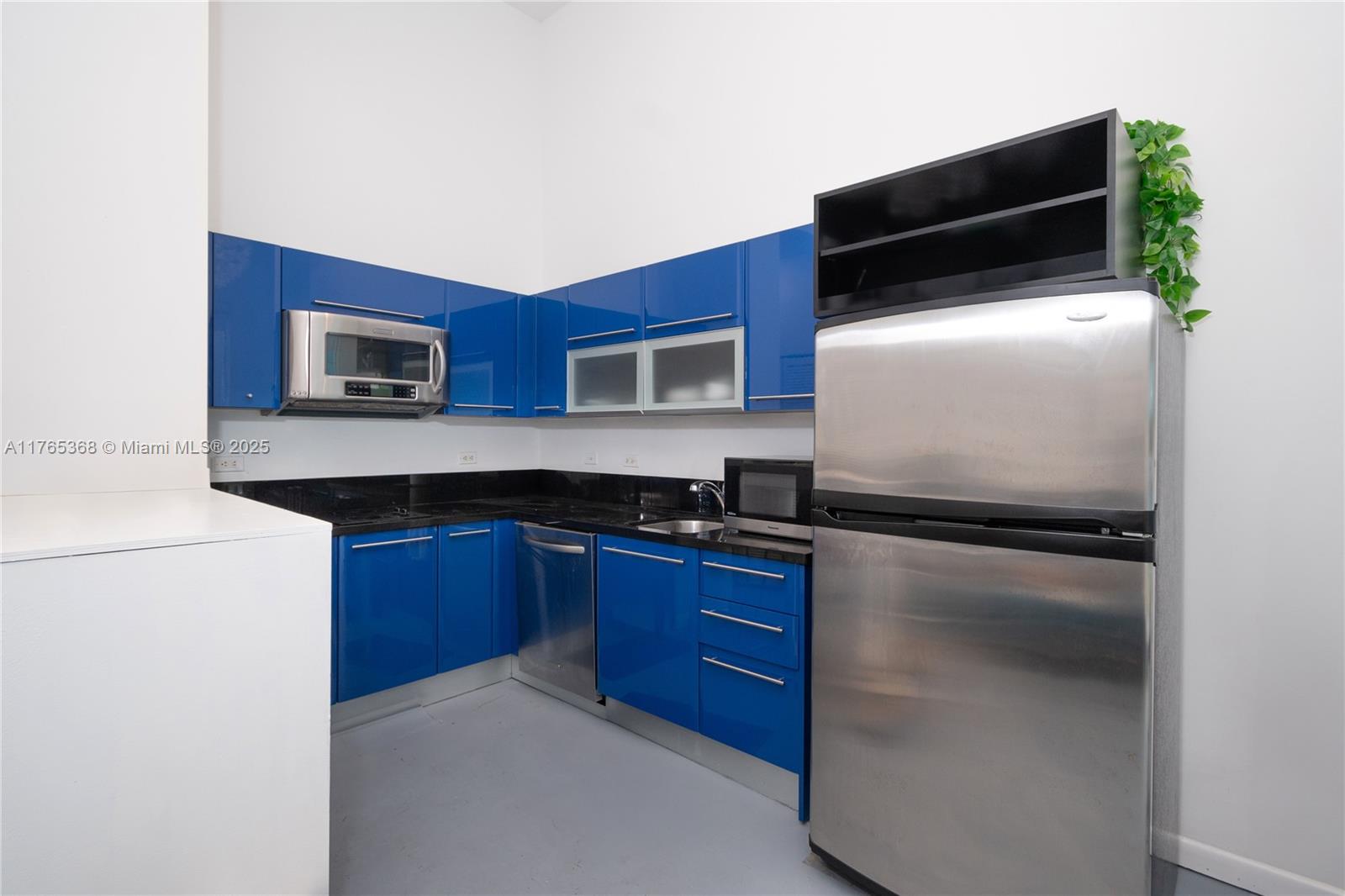 Miami Central Business District Miami, FL 33132 - Photo 2 of 23 a kitchen with stainless steel appliances a refrigerator and a stove top oven