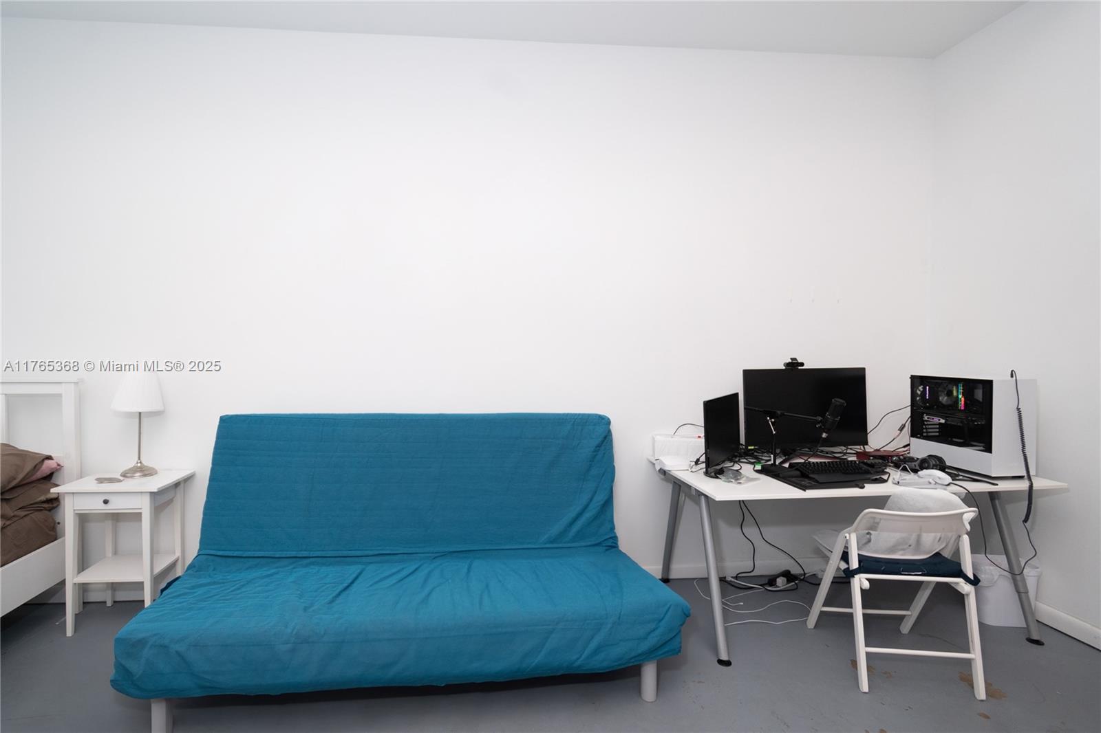 Miami Central Business District Miami, FL 33132 - Photo 5 of 23 a living room with furniture and a flat screen tv