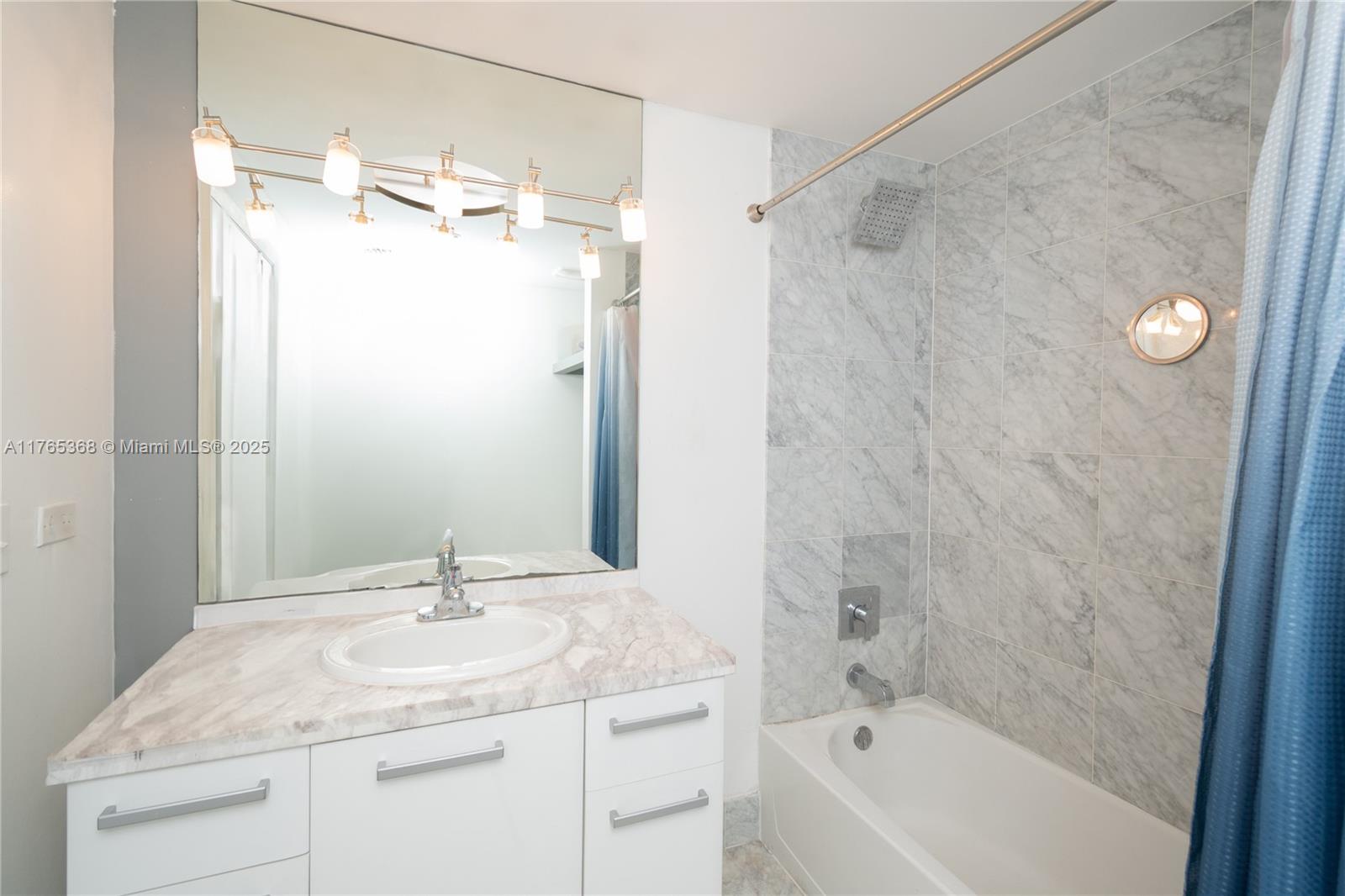 Miami Central Business District Miami, FL 33132 - Photo 8 of 23 a bathroom with a granite countertop sink a toilet and shower