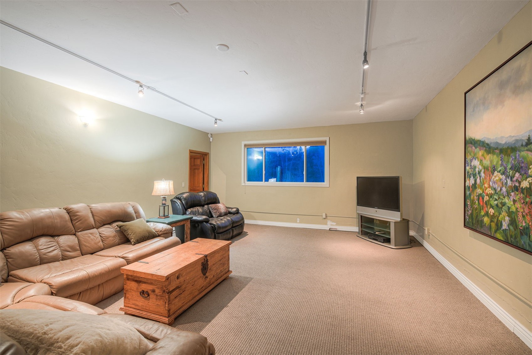 396 Hamilton Creek Road Silverthorne, CO 80498 - Photo 20 of 43 a living room with furniture a flat screen tv and a window