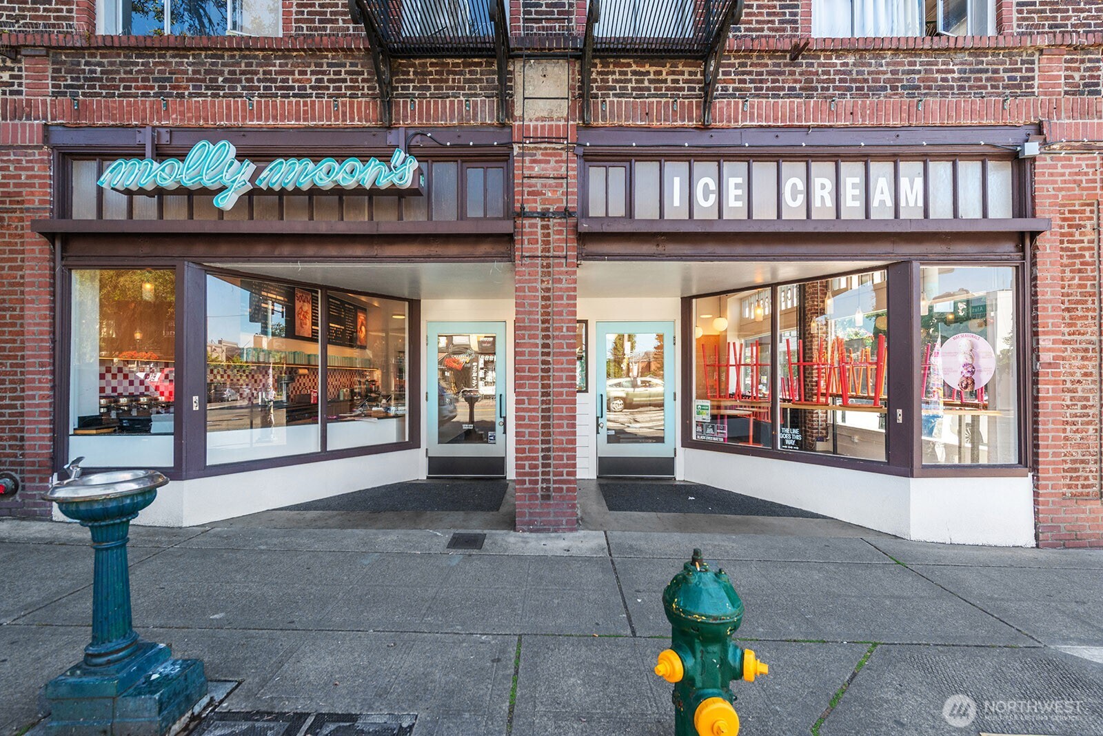 4407 Southwest Alaska Street, Unit 11 Seattle, WA 98116 - Photo 22 of 24 a front view of a building with glass windows and door