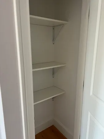 a view of an empty walk in closet