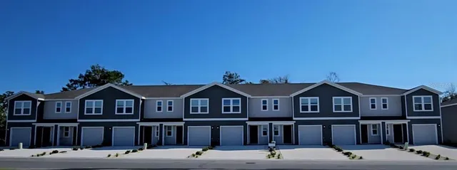 a front view of residential houses with street