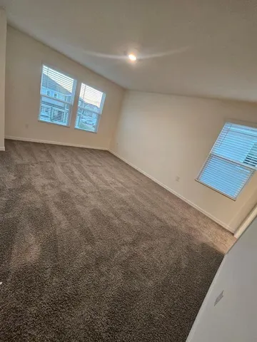 an empty room with windows