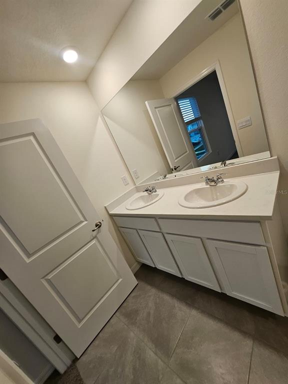 6577 Southwest 81st Loop Ocala, FL 34476 - Photo 16 of 25 a bathroom with a sink and a mirror