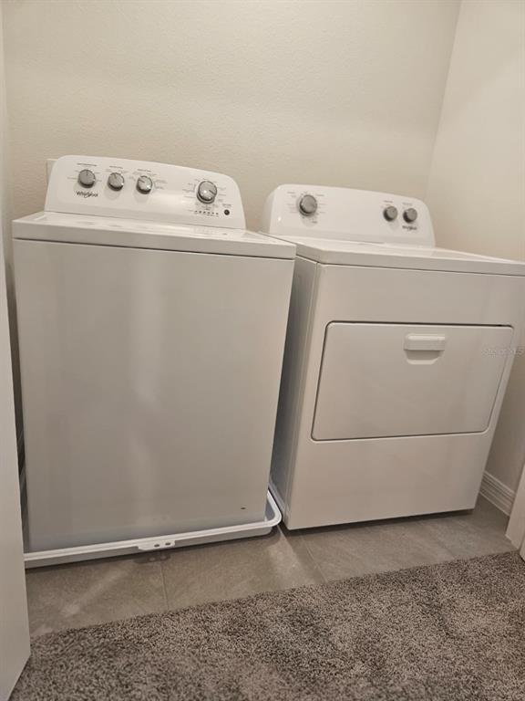 6577 Southwest 81st Loop Ocala, FL 34476 - Photo 21 of 25 a utility room with dryer and washer