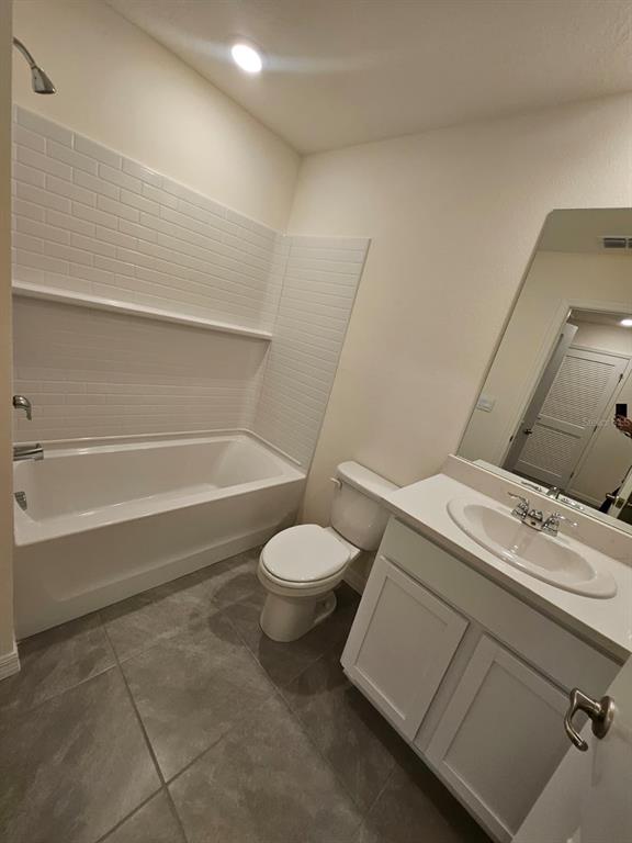 6577 Southwest 81st Loop Ocala, FL 34476 - Photo 23 of 25 a bathroom with a sink a toilet and shower