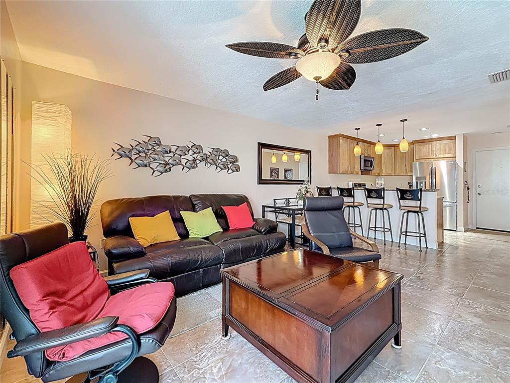 230 Medallion Boulevard, Unit G Madeira Beach, FL 33708 - Photo 14 of 44 a living room with furniture