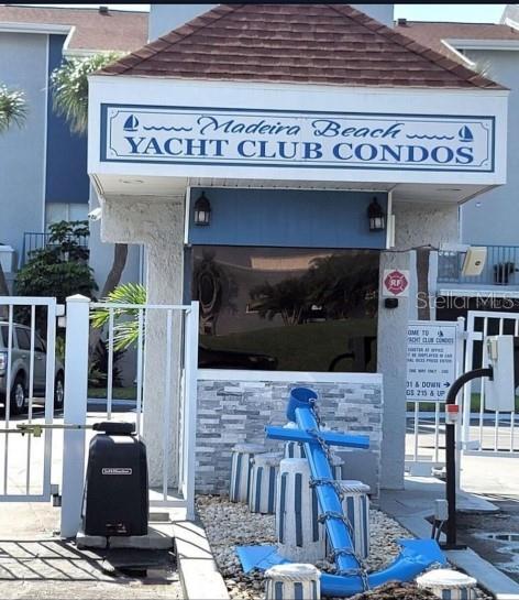 230 Medallion Boulevard, Unit G Madeira Beach, FL 33708 - Photo 30 of 44 a front view of a retail shop with glass windows