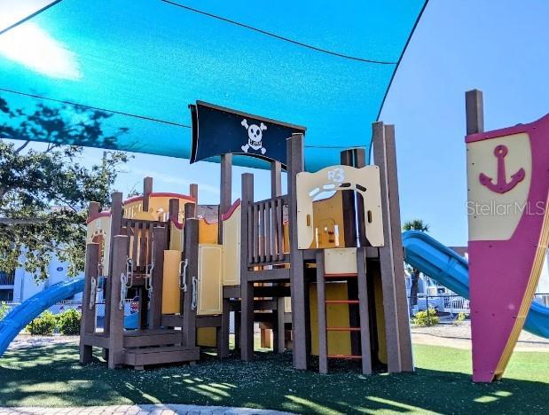 230 Medallion Boulevard, Unit G Madeira Beach, FL 33708 - Photo 39 of 44 a front view of a house with a yard