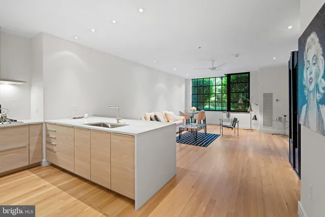 a view of kitchen with sink and wooden floor