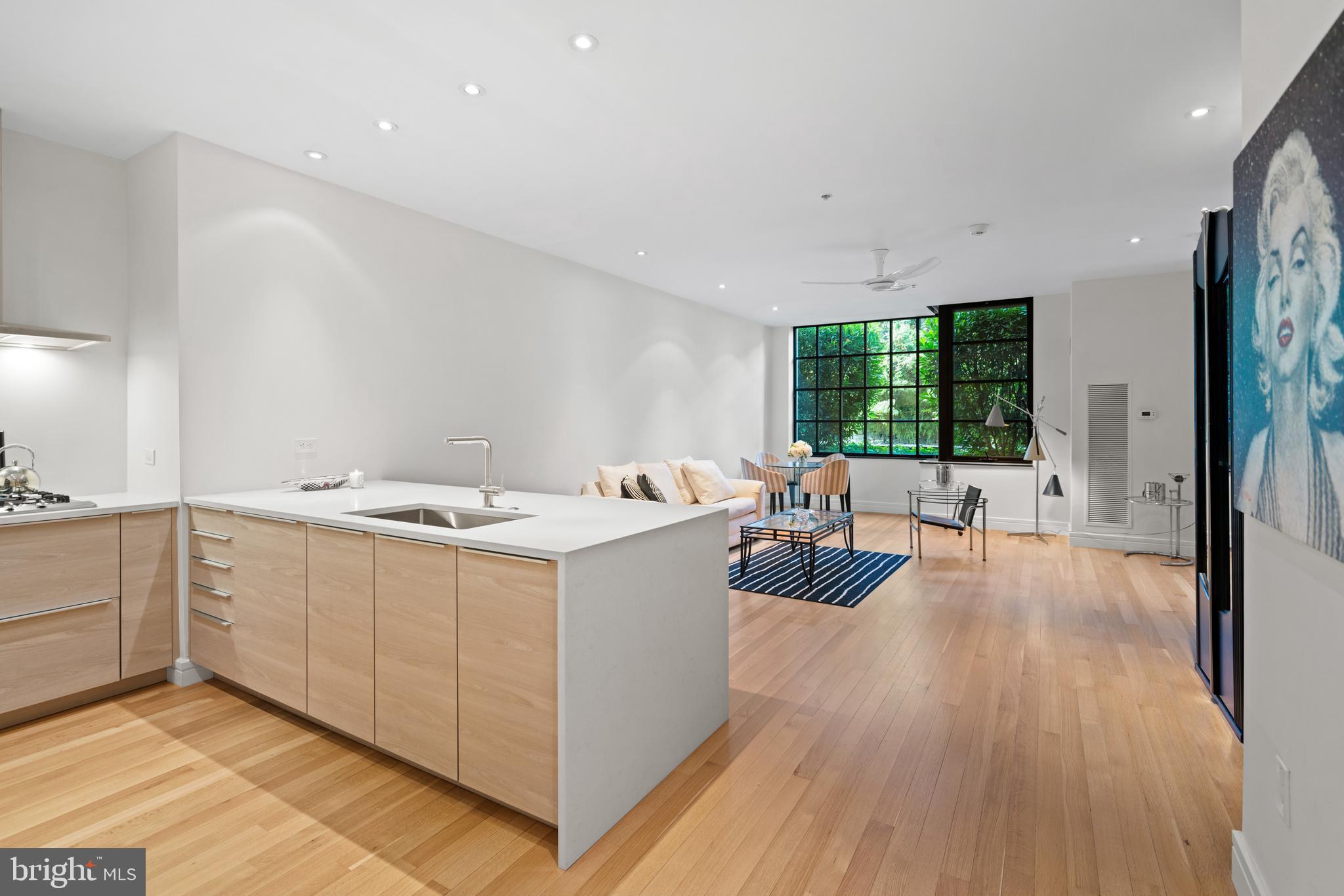 3303 Water Street Northwest, Unit 3B Washington, DC 20007 - Photo 1 of 25 a view of kitchen with sink and wooden floor