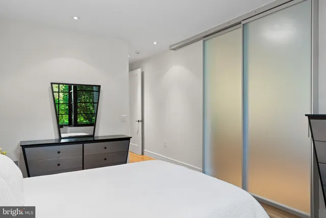 a room with a bed and a window