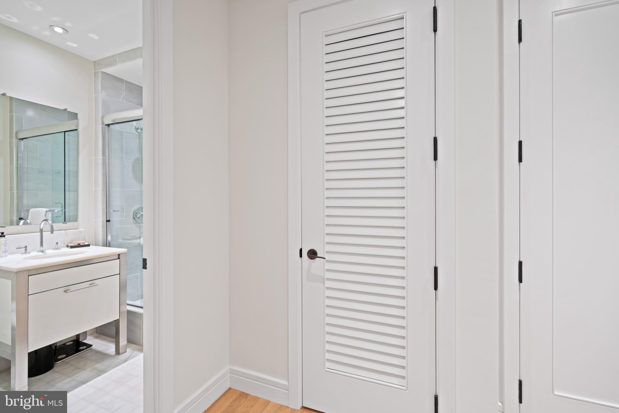3303 Water Street Northwest, Unit 3B Washington, DC 20007 - Photo 12 of 25 a bathroom with a sink and a mirror