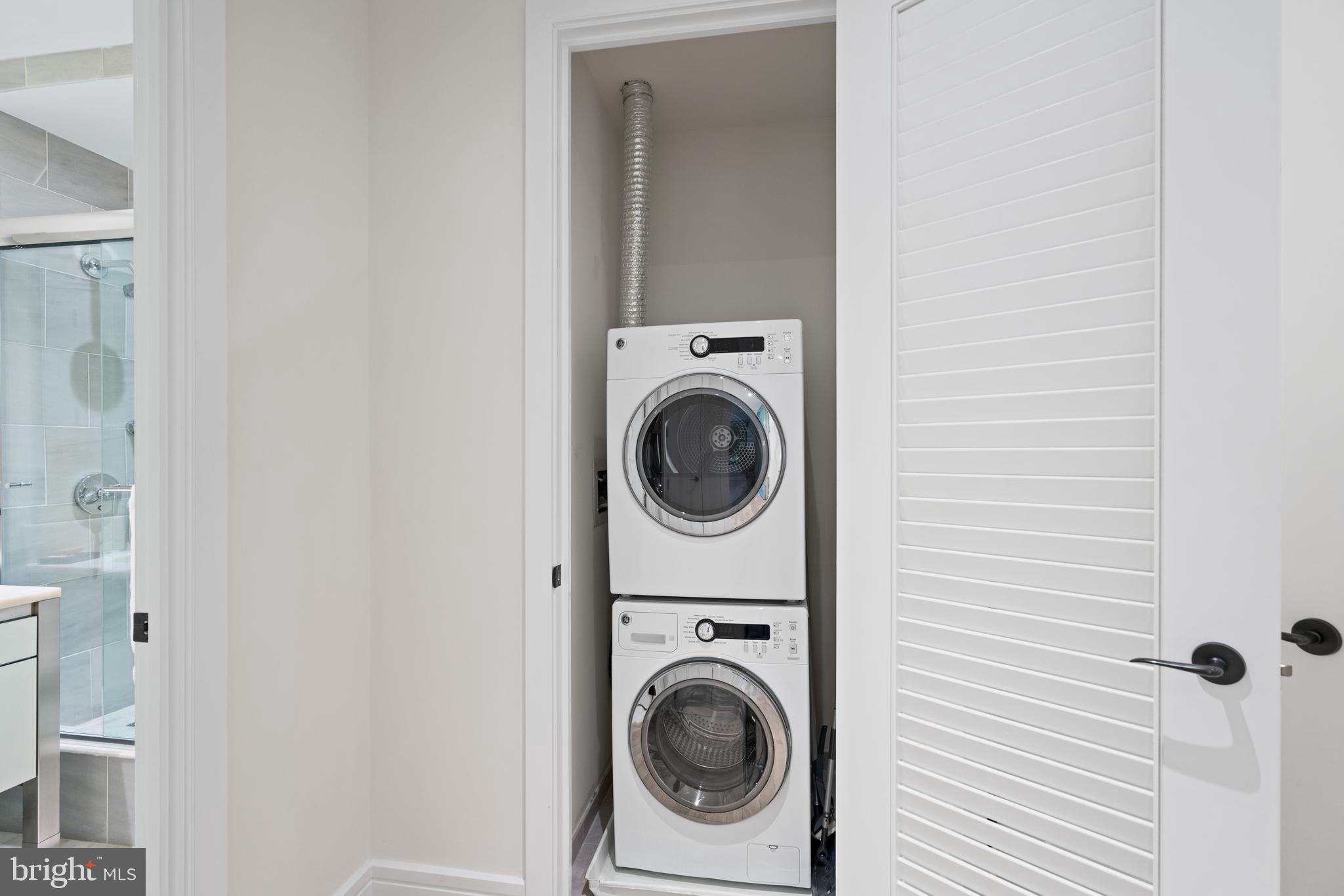 3303 Water Street Northwest, Unit 3B Washington, DC 20007 - Photo 15 of 25 a utility room with dryer and washer